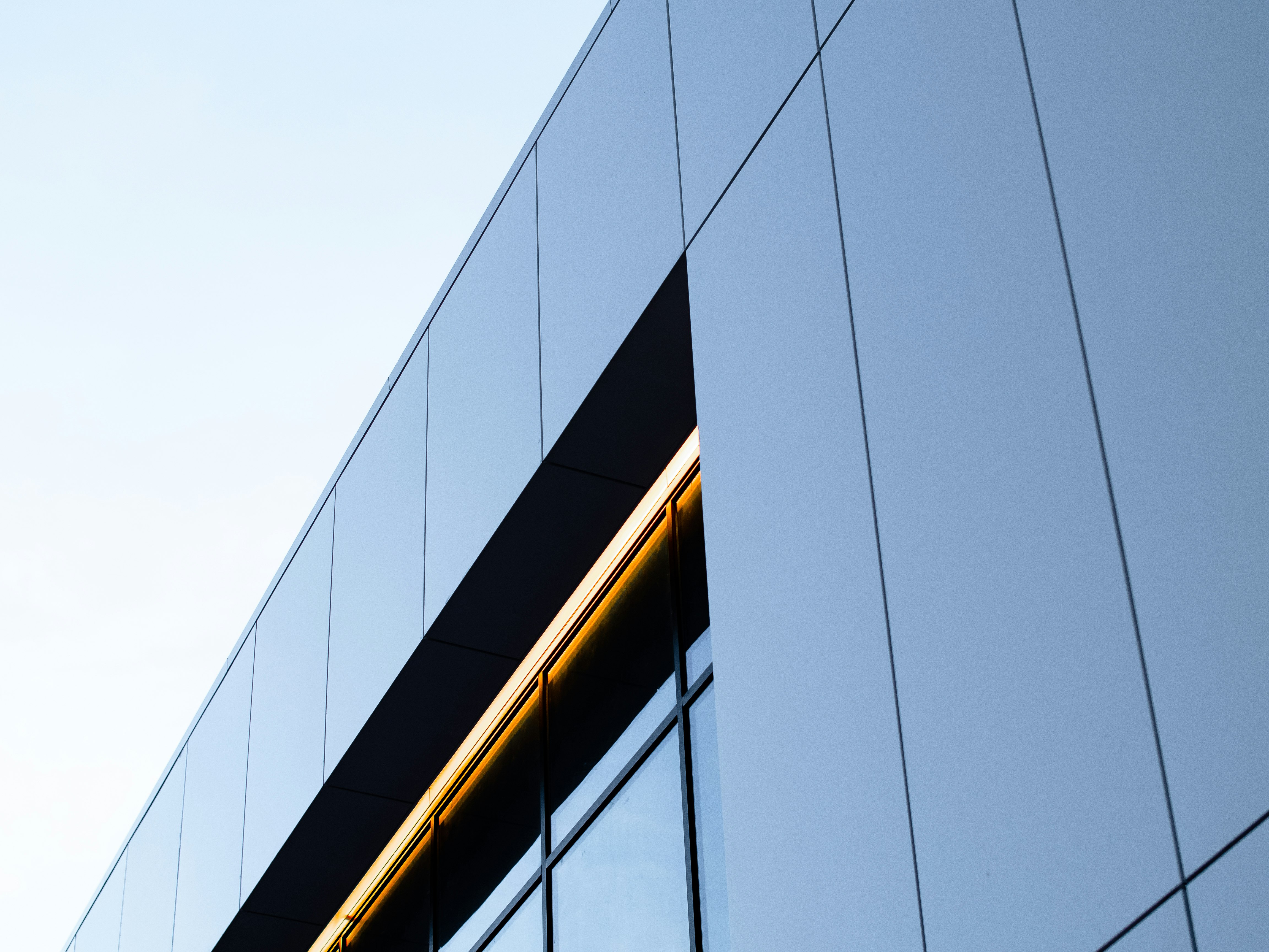 black and yellow glass walled building